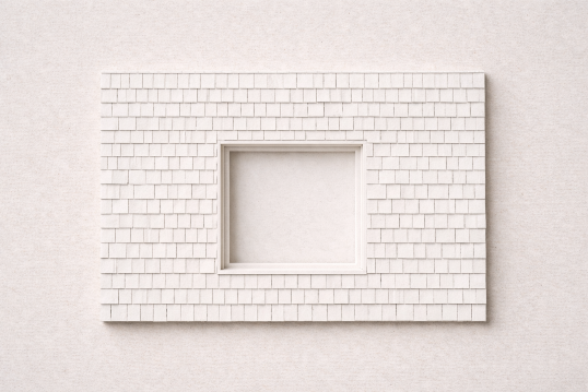 White textured wall with a centered rectangular window opening.