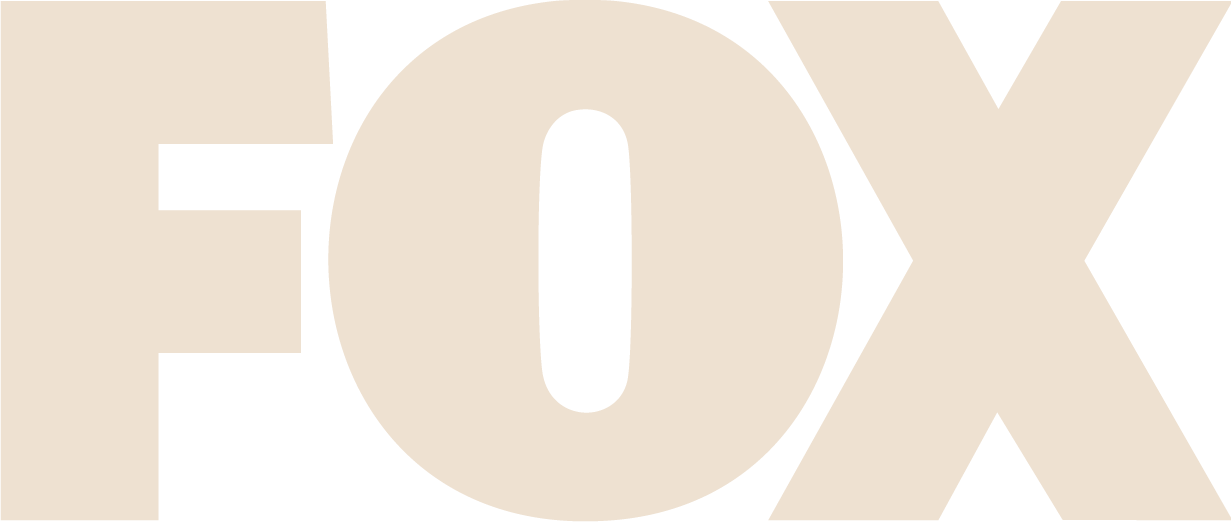 Close-up of the word "FOX" in large cream-colored letters on a black background.