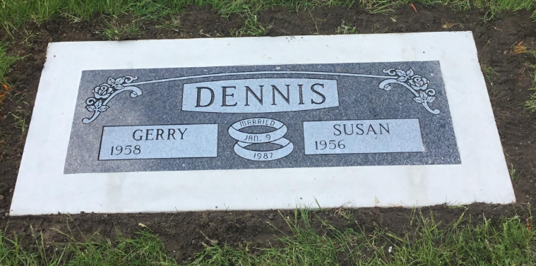 Gravestone for Dennis with names Gerry and Susan, birth years 1958 and 1956, married on January 9, 1981, with floral designs on the top corners.