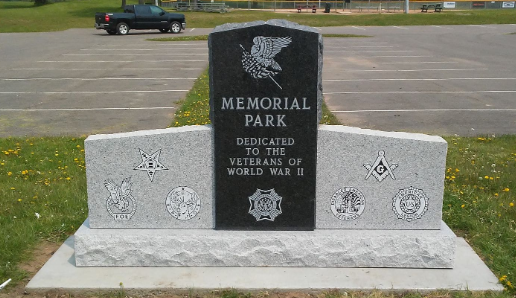 Memorial Park monument with veterans' emblems and a large eagle engraving