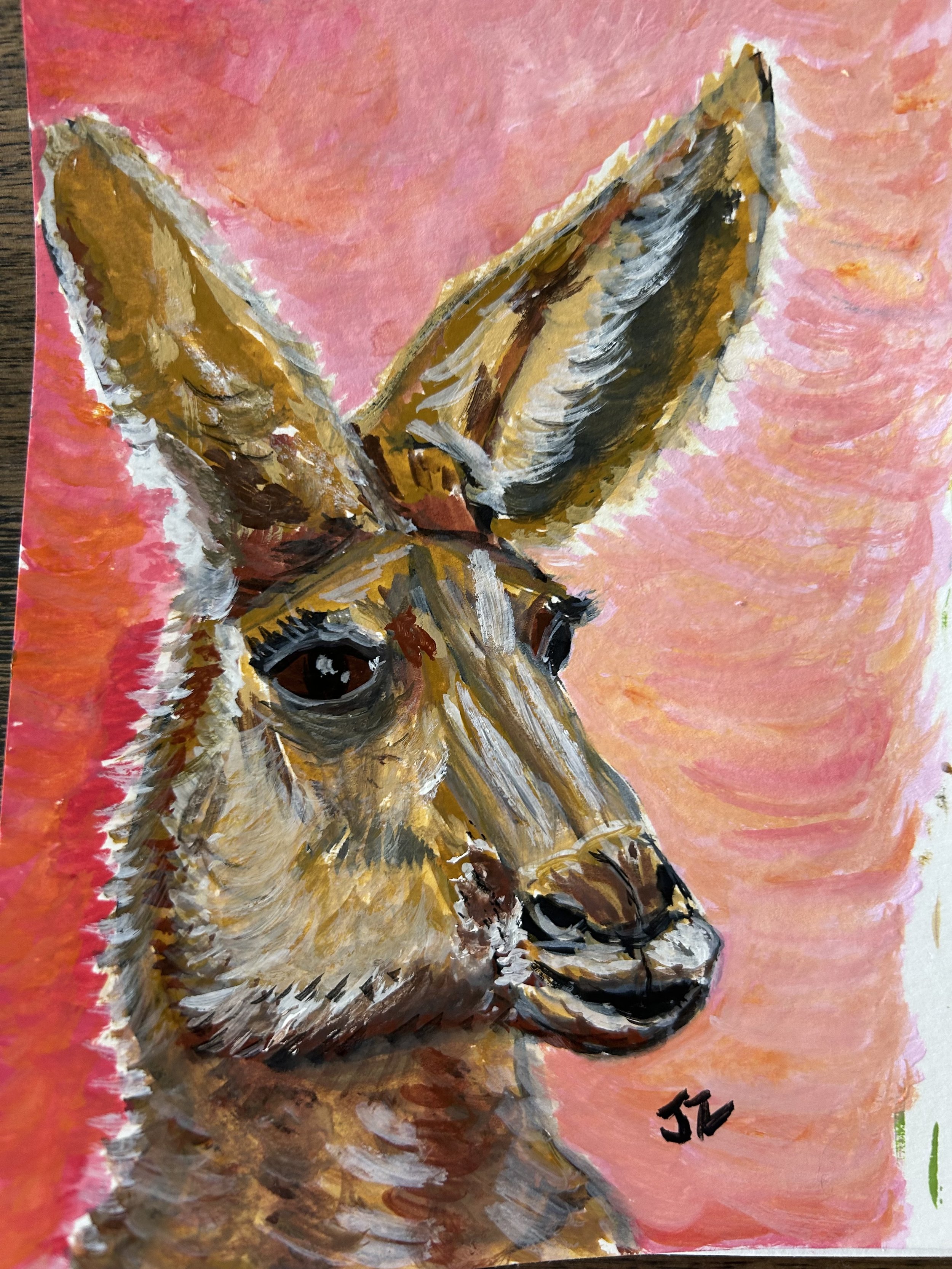 Watercolor painting of a kangaroo against a pink and orange background.