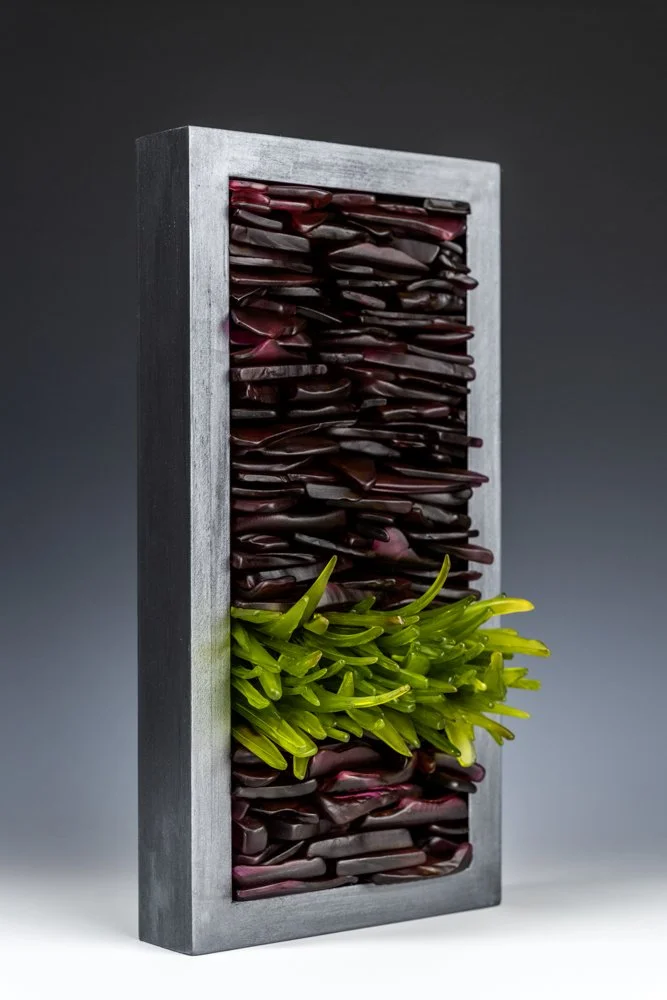 Upcycled spirit and wine bottles hand dyed and turned into a wall hanging made in Puerto Rico