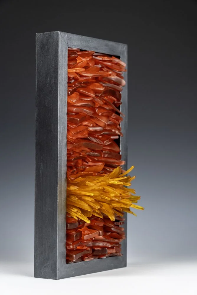 Upcycled spirit and wine bottles hand dyed and turned into a wall hanging made in Puerto Rico