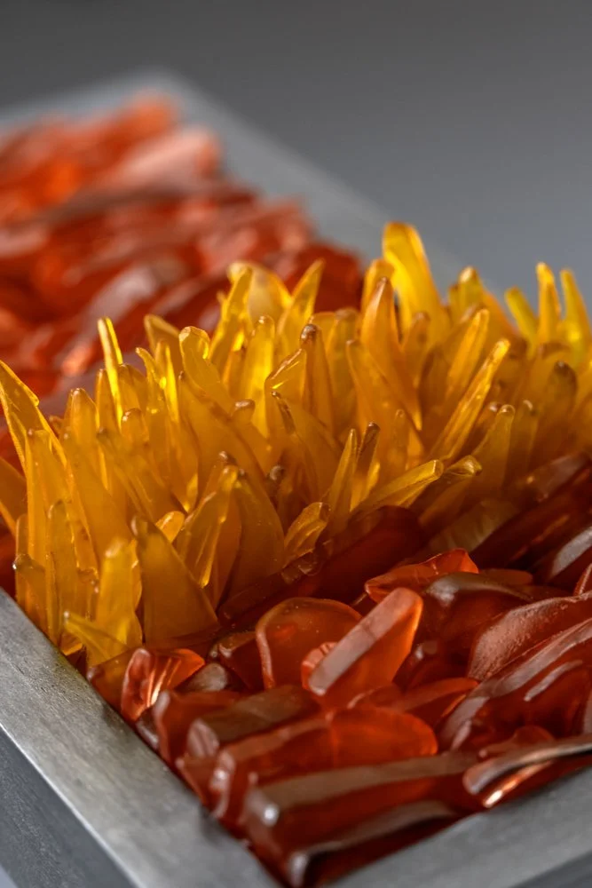 Upcycled spirit and wine bottles hand dyed and turned into a wall hanging made in Puerto Rico