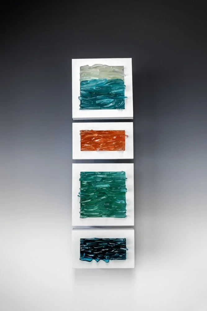 Upcycled spirit and wine bottles hand dyed and turned into a wall hanging made in Puerto Rico