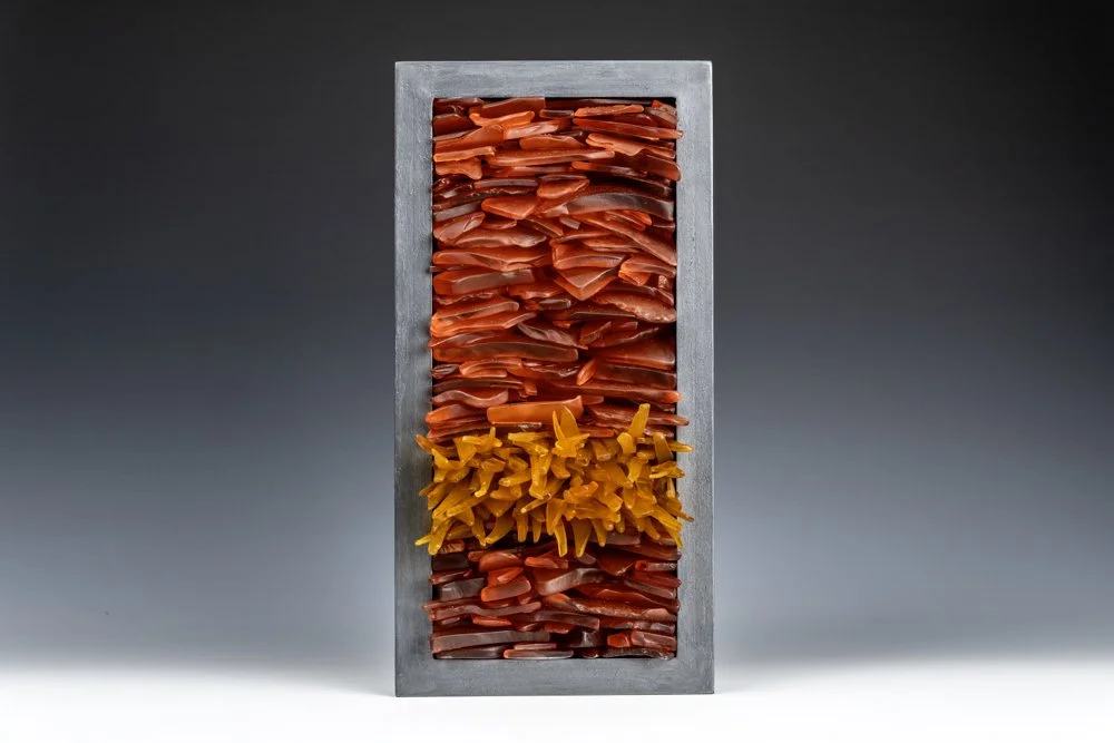 Upcycled spirit and wine bottles hand dyed and turned into a wall hanging made in Puerto Rico