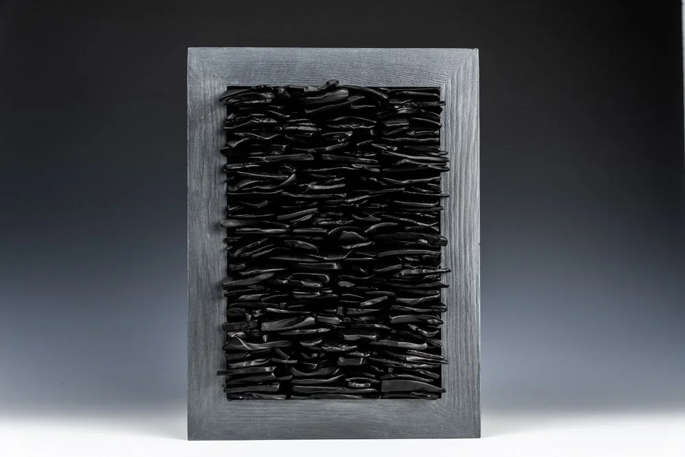 Upcycled spirit and wine bottles hand dyed and turned into a wall hanging made in Puerto Rico