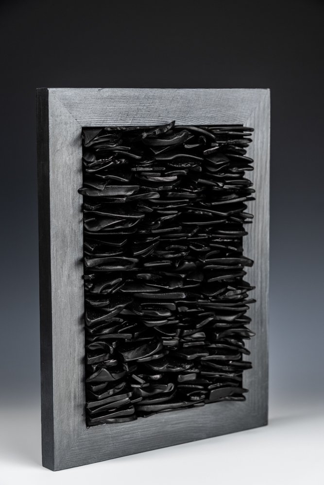 Upcycled spirit and wine bottles hand dyed and turned into a wall hanging made in Puerto Rico