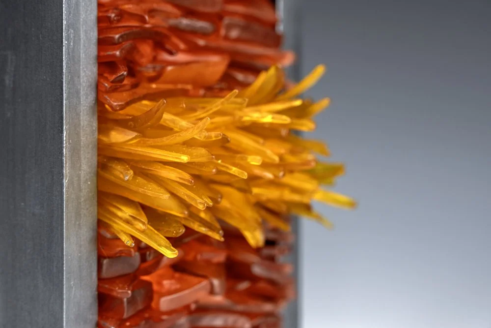 Upcycled spirit and wine bottles hand dyed and turned into a wall hanging made in Puerto Rico