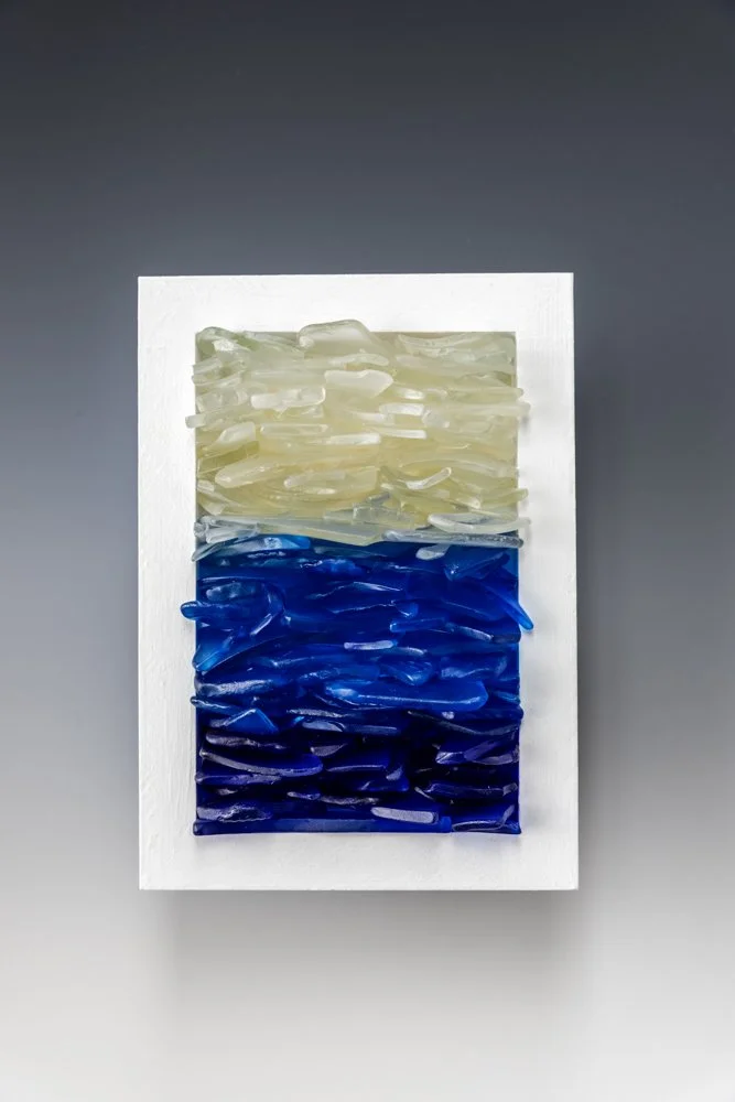 Upcycled spirit and wine bottles hand dyed and turned into a wall hanging made in Puerto Rico