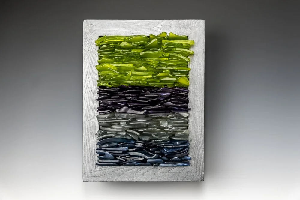 Upcycled spirit and wine bottles hand dyed and turned into a wall hanging made in Puerto Rico