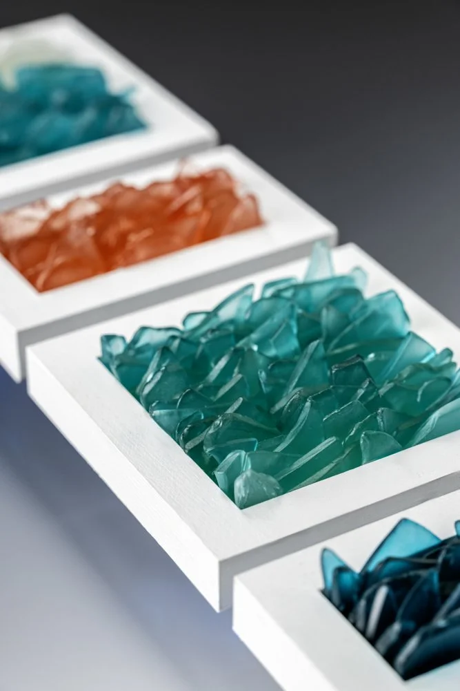 Upcycled spirit and wine bottles hand dyed and turned into a wall hanging made in Puerto Rico