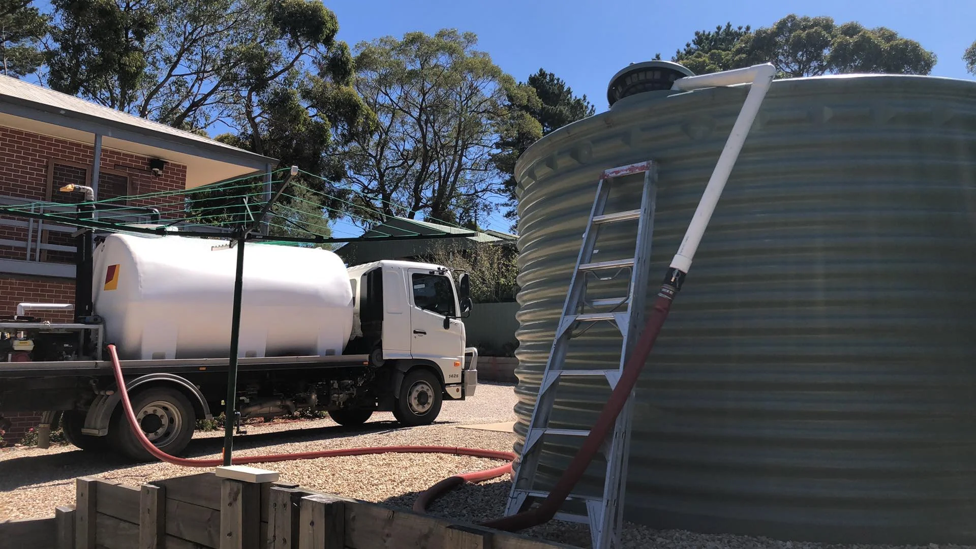 Water truck filling rainwater tank