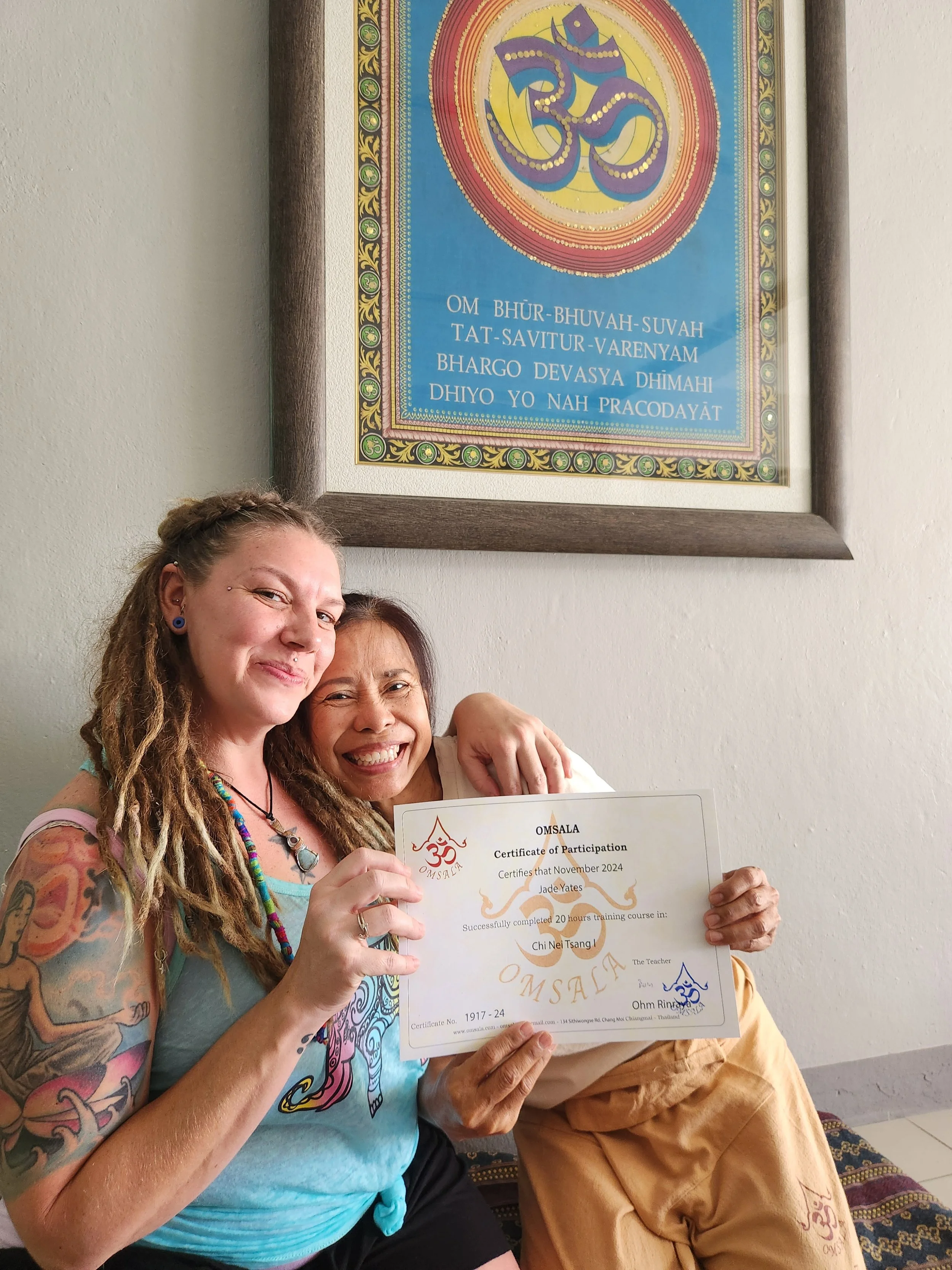 Jade receiving a certificate after completing an abdominal massage class called Chi Nei Tsang at Omsala in Chiang Mai Thailand on a study abroad trip in 2024.