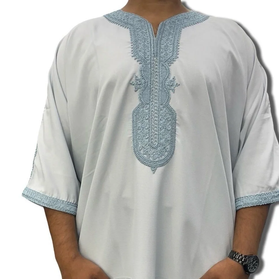 Inspired by the ocean and designed for elegance &mdash; The Ocean Crest combines crisp white fabric with detailed sky-blue embroidery.
This thobe stands out effortlessly and brings a fresh, unique look to your collection.

Perfect for sunnier days, J