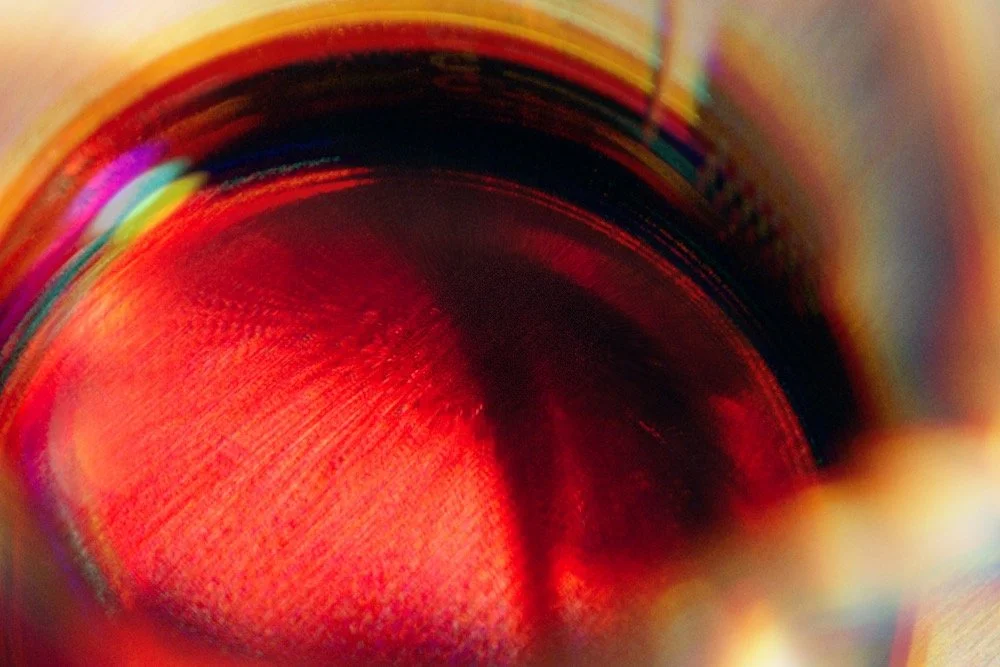 Close-up of the inside of a colorful, cylindrical object, possibly a camera lens or a tube.