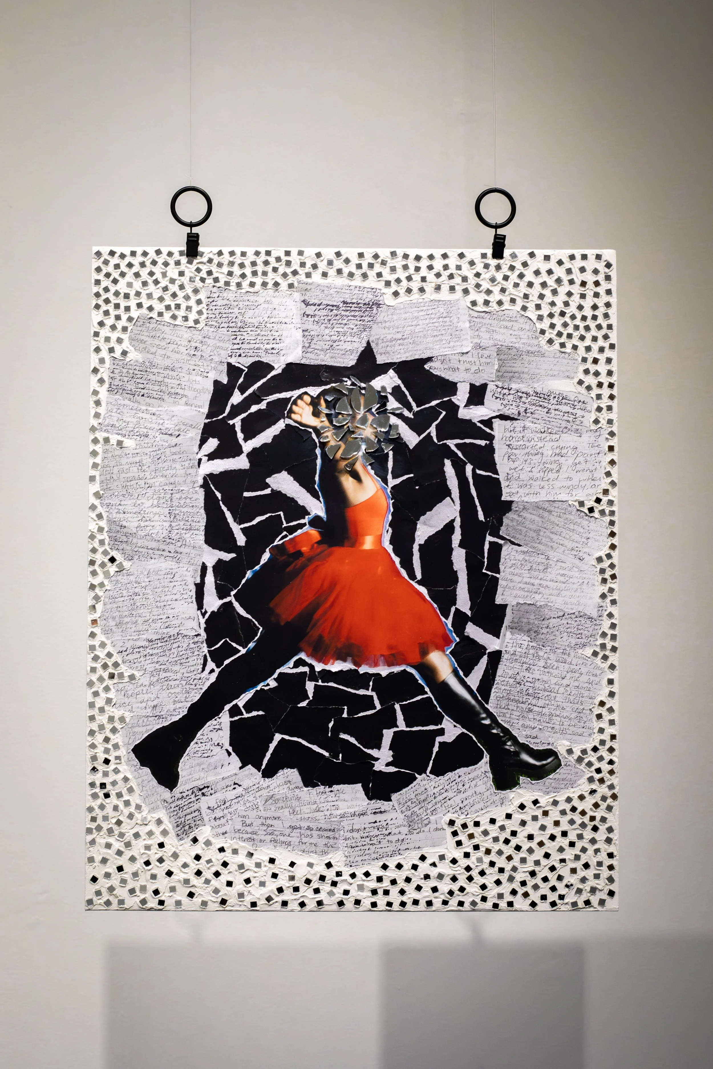 Mixed-media collage artwork featuring a dancer in an orange dress jumping through a torn black and white background with handwritten notes around the edges.