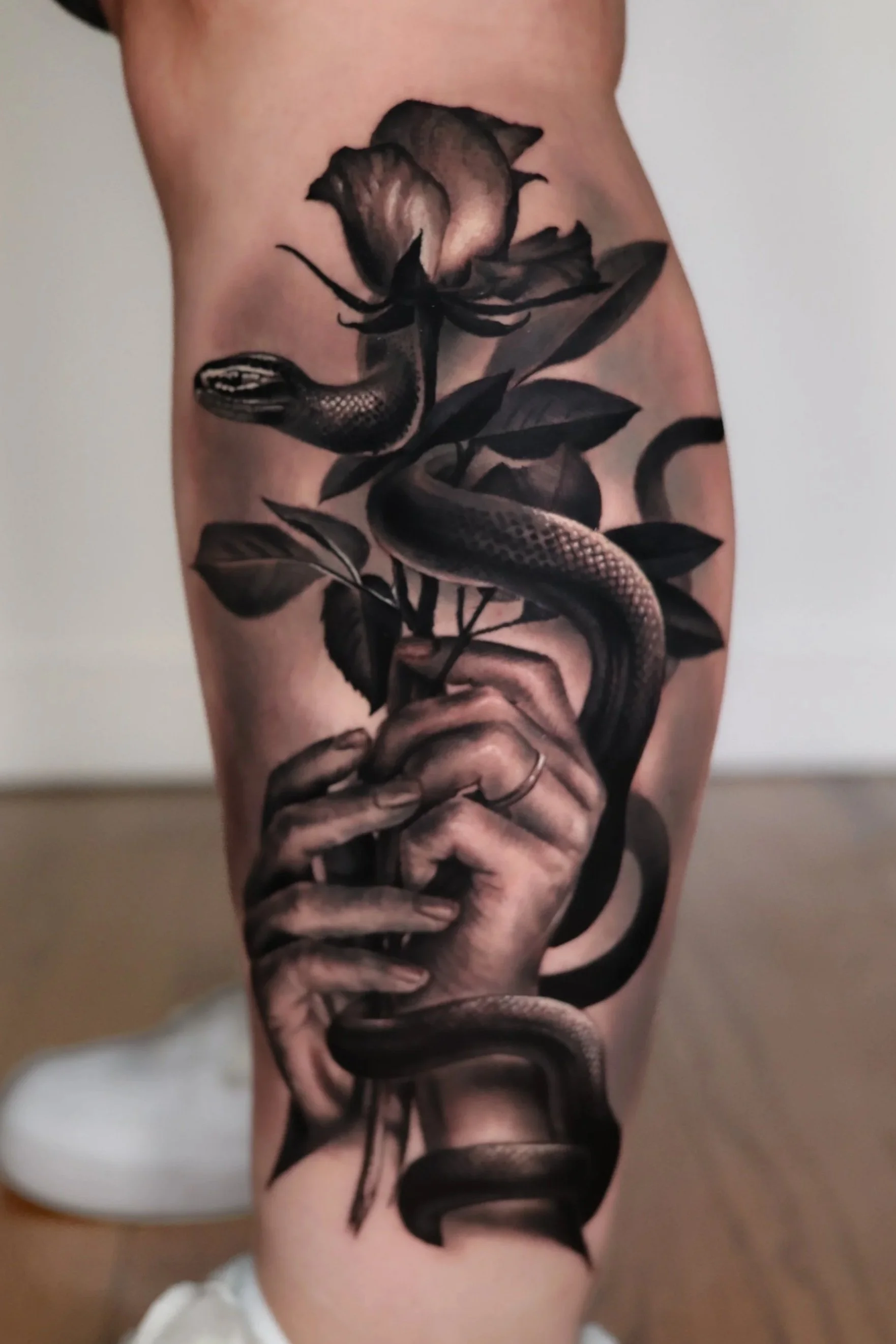 blackandgrey-Realism-snake-flower-tattoo-chicago.jpg