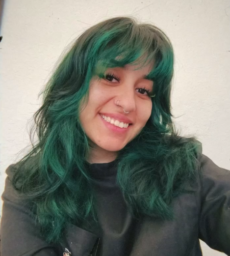 Rose Aguilar, a barber from Off Top Barbershop.