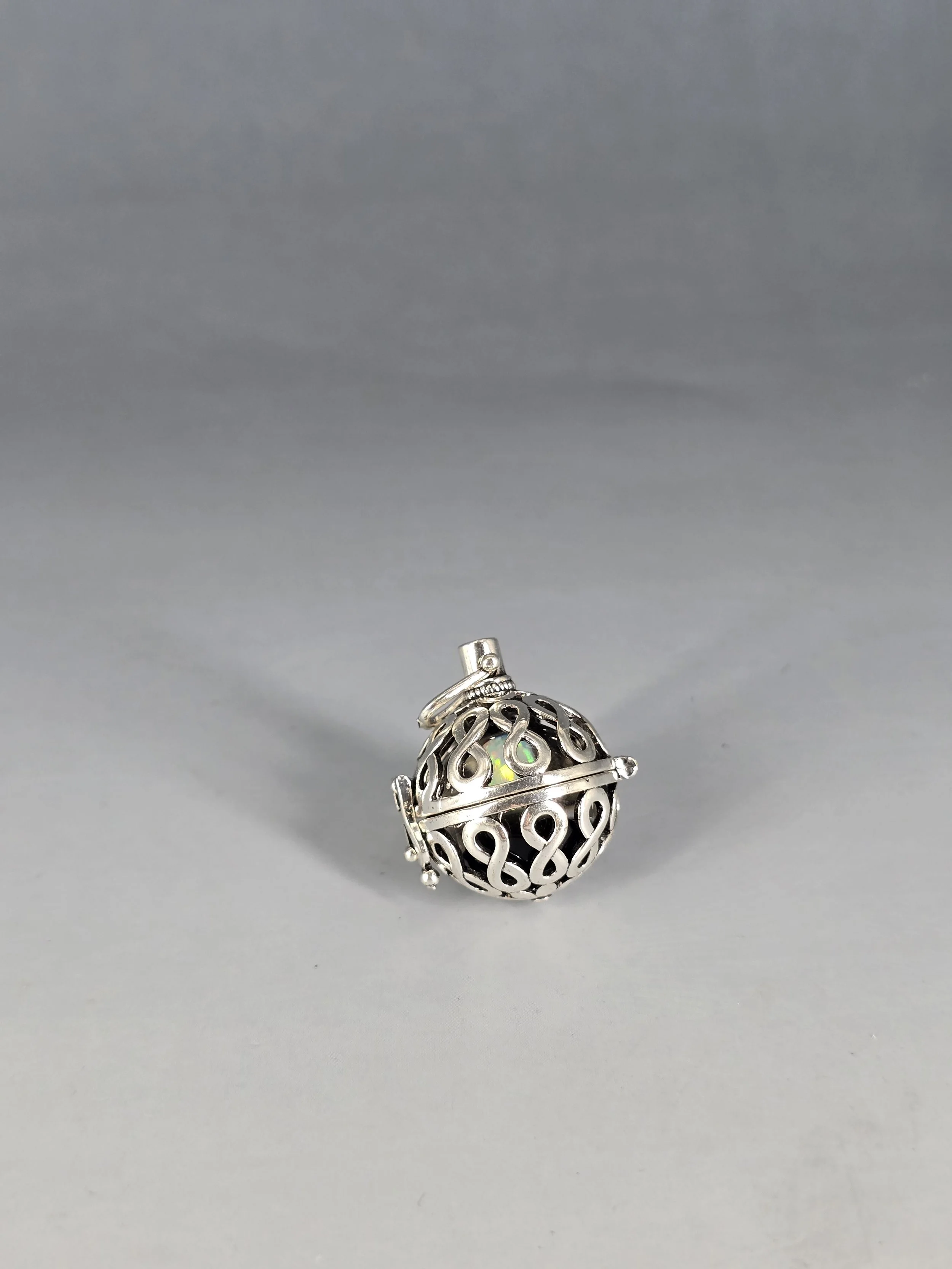 Exquisite Caged Opal Pendant