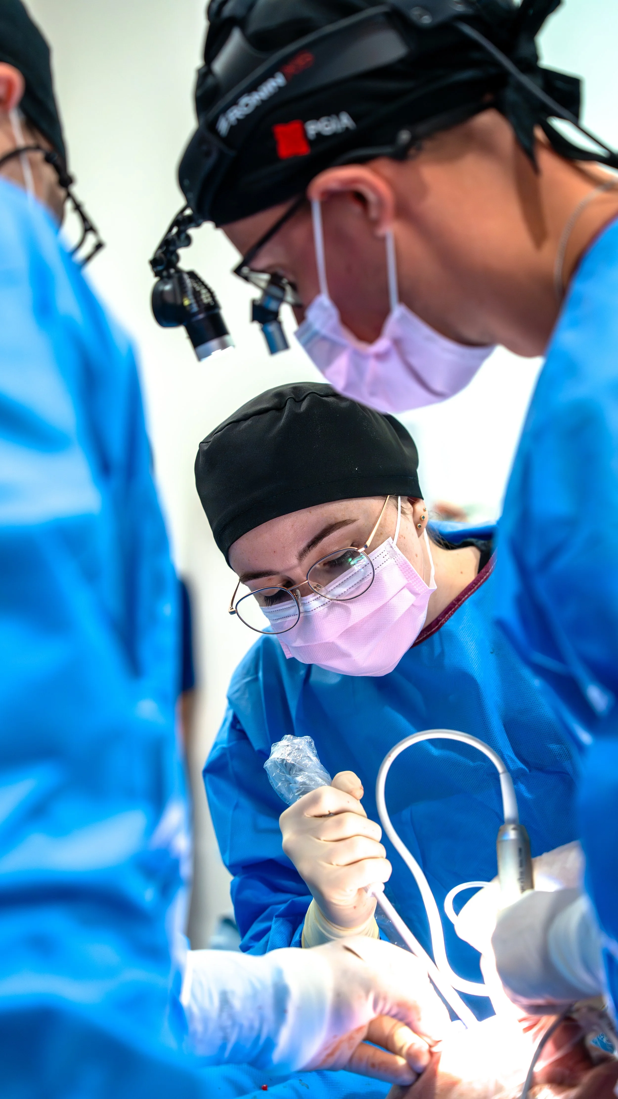 Dental implant course featuring live patient surgical training