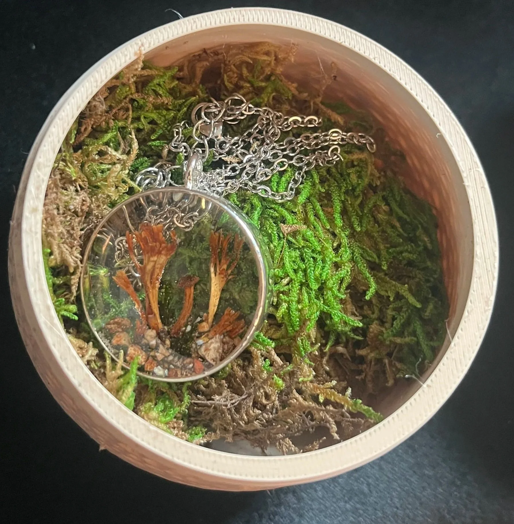 How the actual gift (the necklace) was presented.
