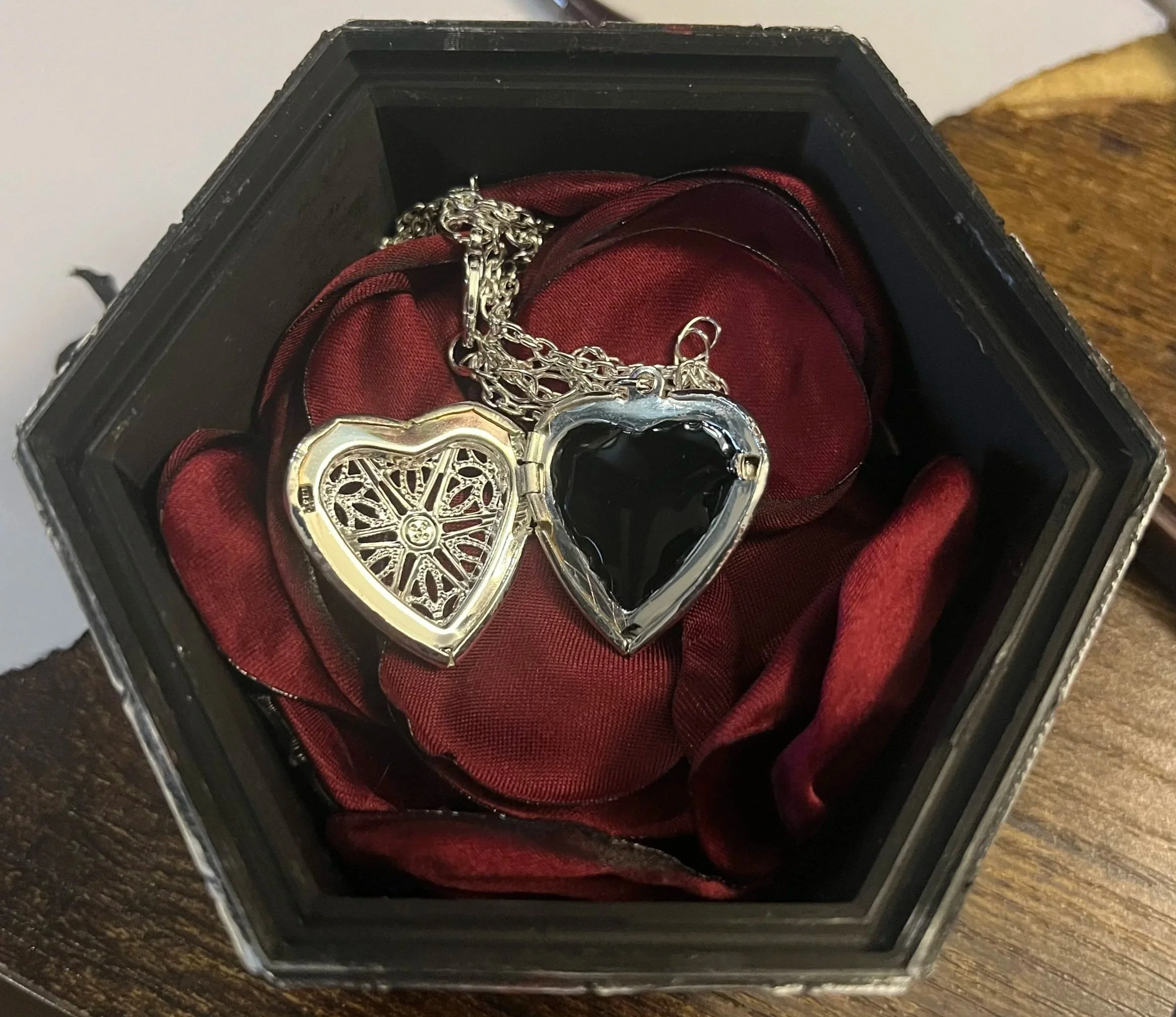How the actual gift (the necklace) was presented.