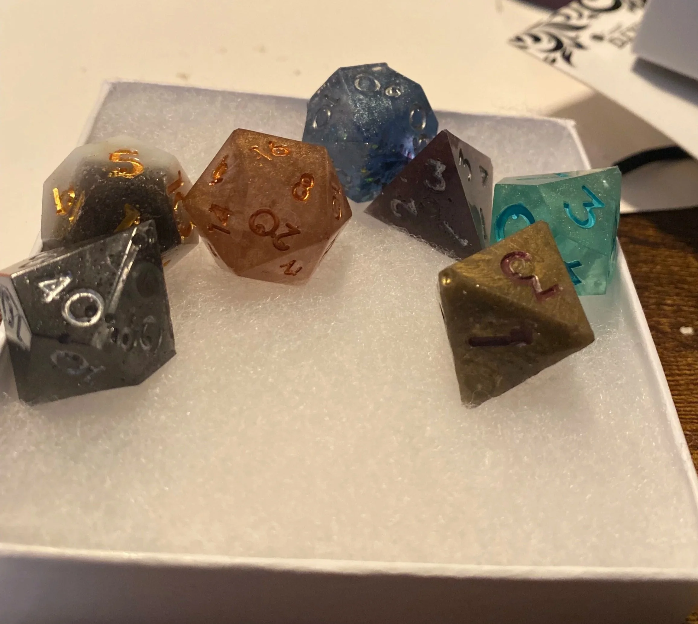 At the end of our first big campaign, I made a set of dice for each of the players that contained a die that referenced all of our characters. This photo is a picture of the set I kept for myself and still have handy on my desk. 