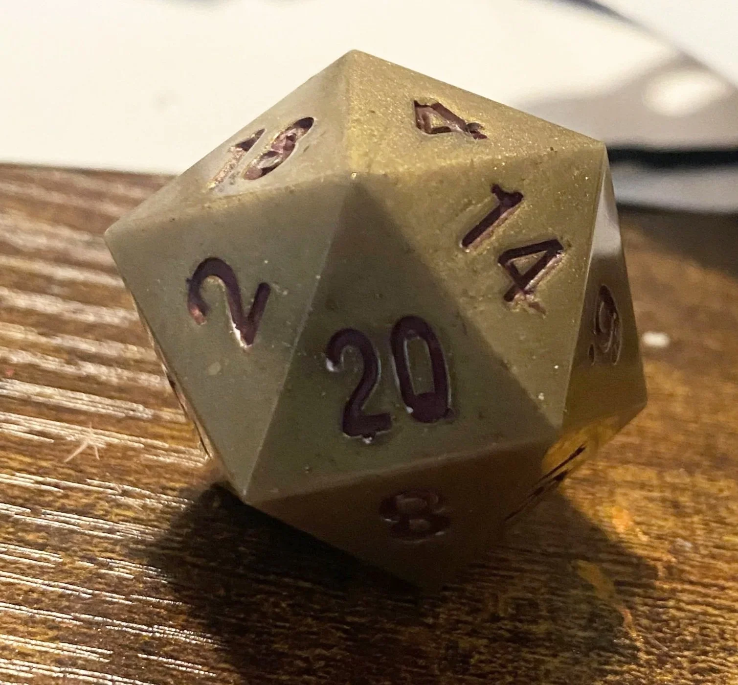 At the end of our first big campaign, I made a set of dice for each of the players that contained a die that referenced all of our characters. This was for our bard - who was just our golden guy and deserved to be presented as such. The resin was opa