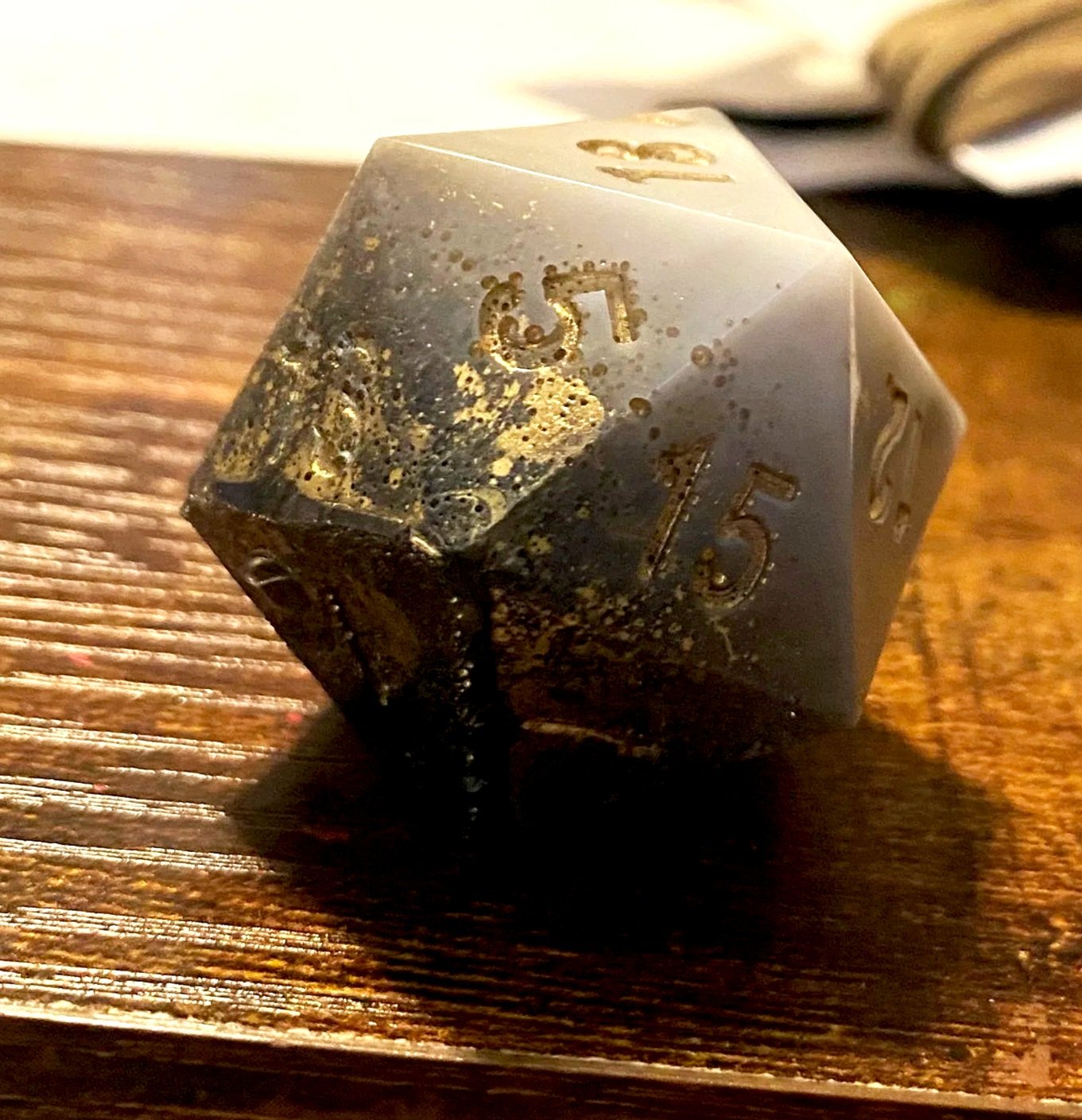 At the end of our first big campaign, I made a set of dice for each of the players that contained a die that referenced all of our characters. This was for a character who faced his darkness and found his light. This was also not my best fight agains