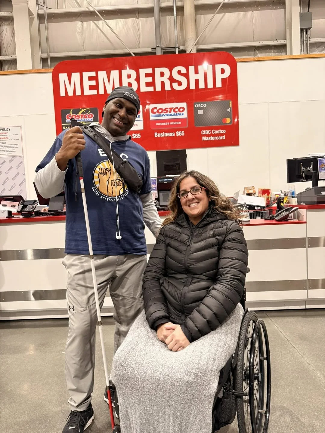 mage shows Susan, President and Sheldon Guy, Vice President of EAC in front of the customer service desk inside Costco.