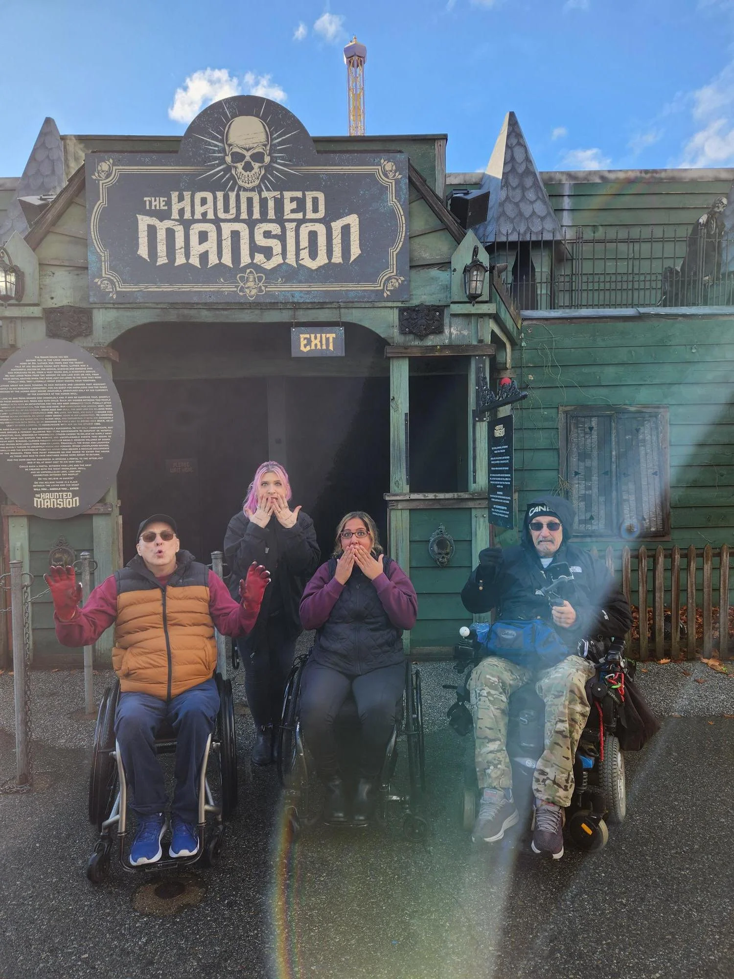 EAC members Rod, Russ and Susan outside of the haunted mansion entrance posing with scared faces