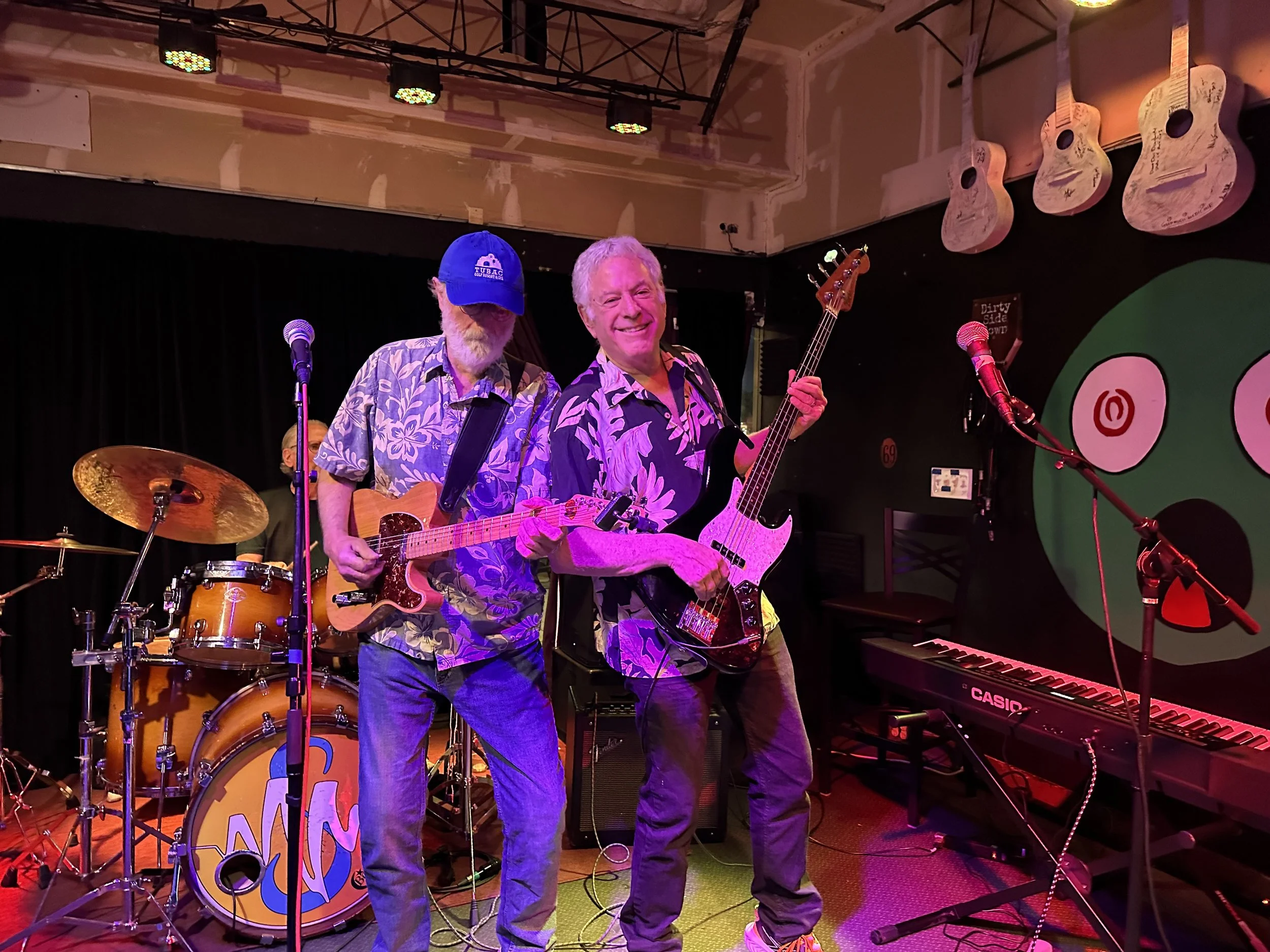 Tom and Bill Swartz performing live on stage.