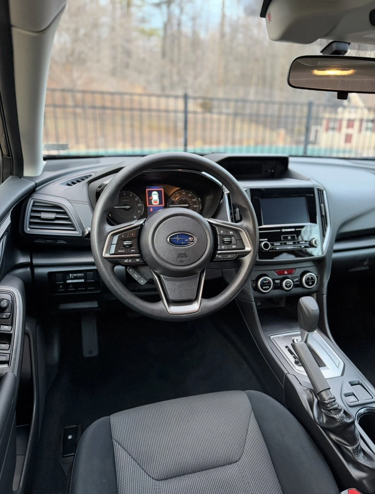 Black interior of a subaru crosstrek that has been detailed