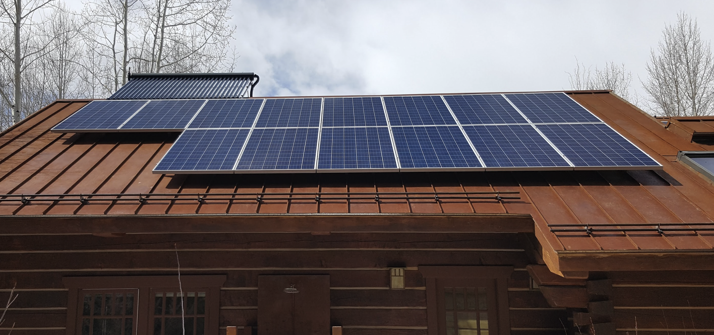 Solar panels mounted on metal standing seam roof