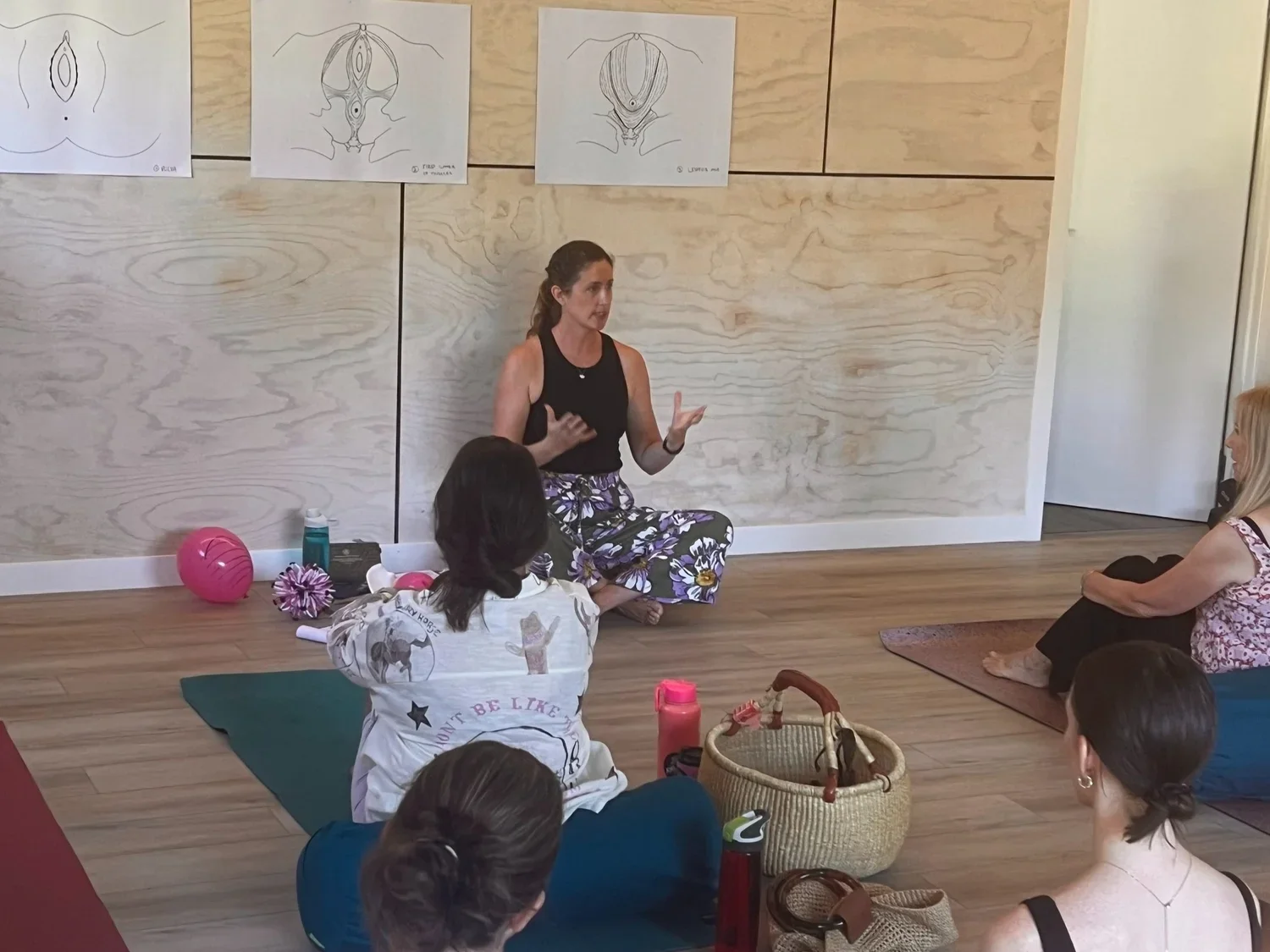 Zoe Wood teaching her pelvic floor health workshop to a large group of woman through all stages of life.