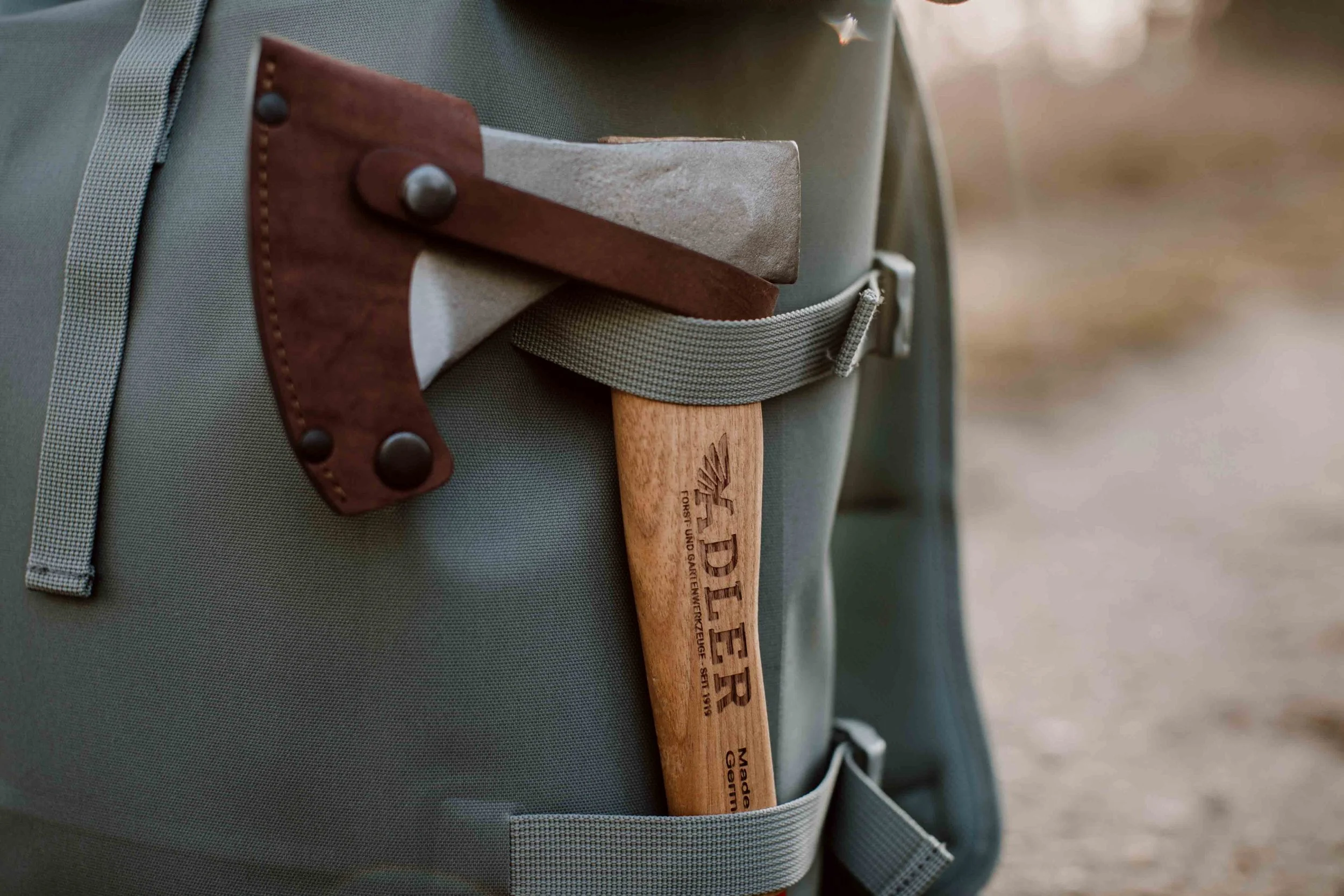 Rheinland 14-inch axe with protective sheath showcasing handle, blade, and safety cover