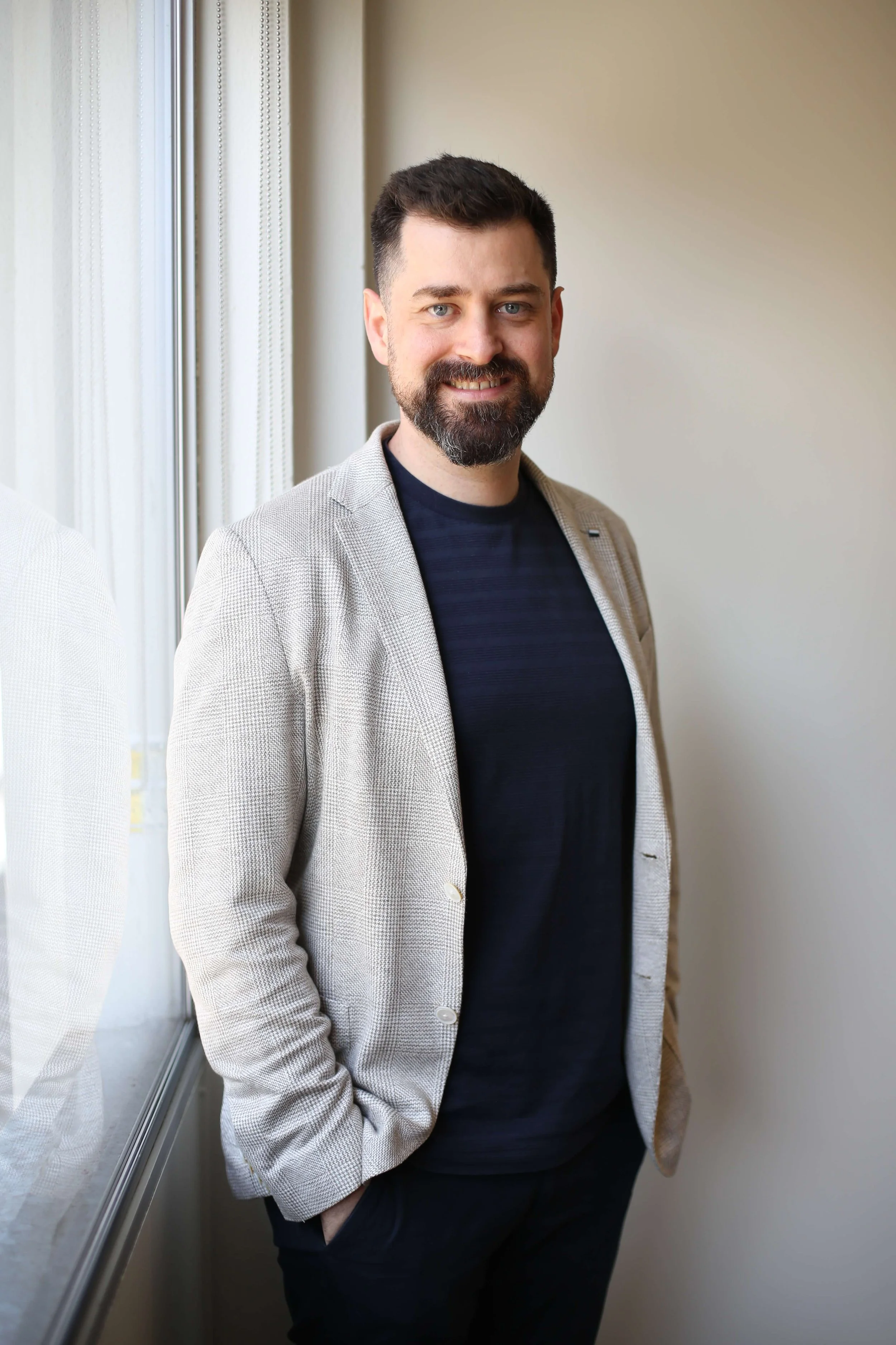 Dr Jeremy Tannenbaum, specialist pain medicine physician and psychiatrist in Perth, Western Australia, pictured in a professional indoor portrait.