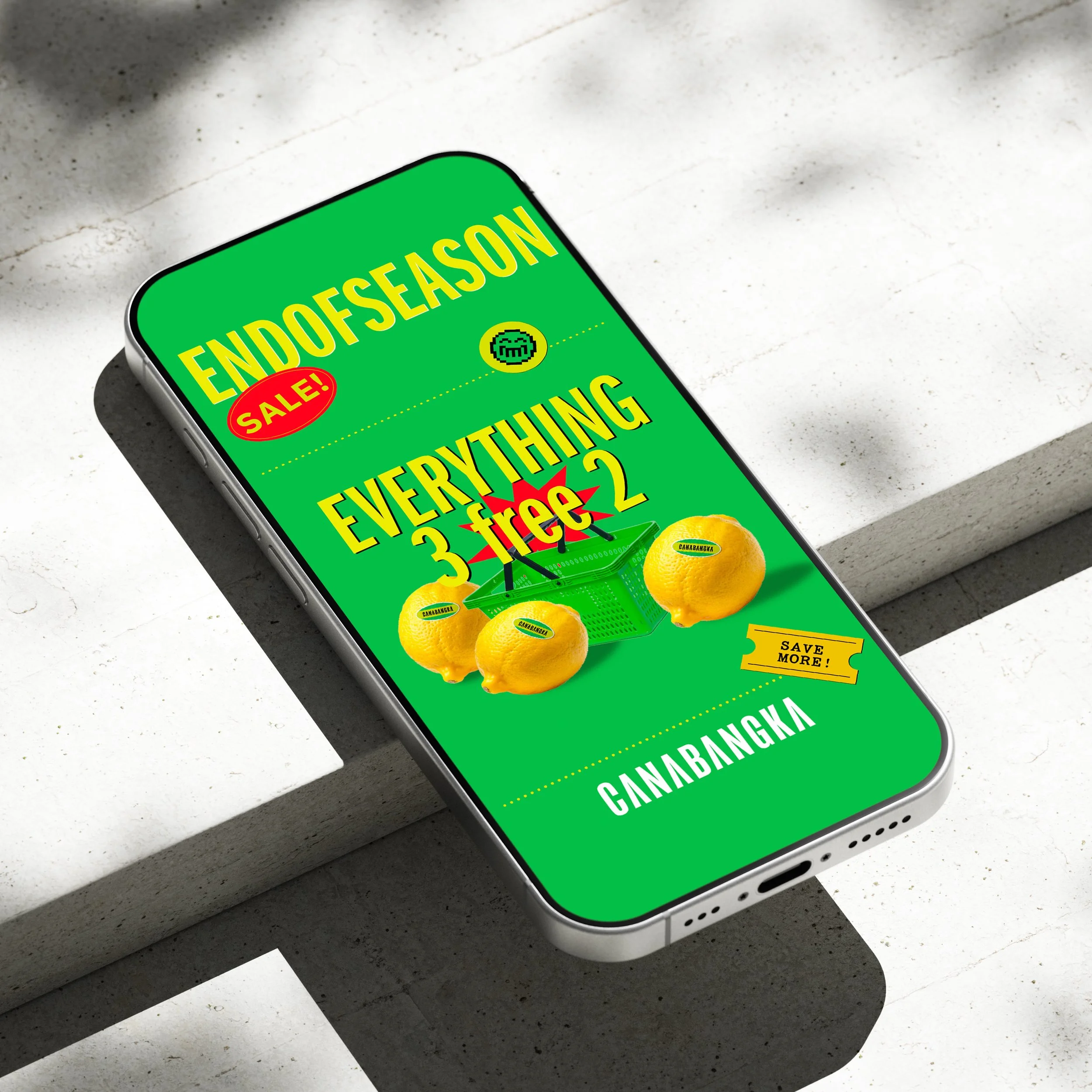 Promotional advertisement on a smartphone for CannaBangka, featuring a green background, lemons, shopping basket, and promotional text for a sale on everything with a buy 3 get 2 free offer.