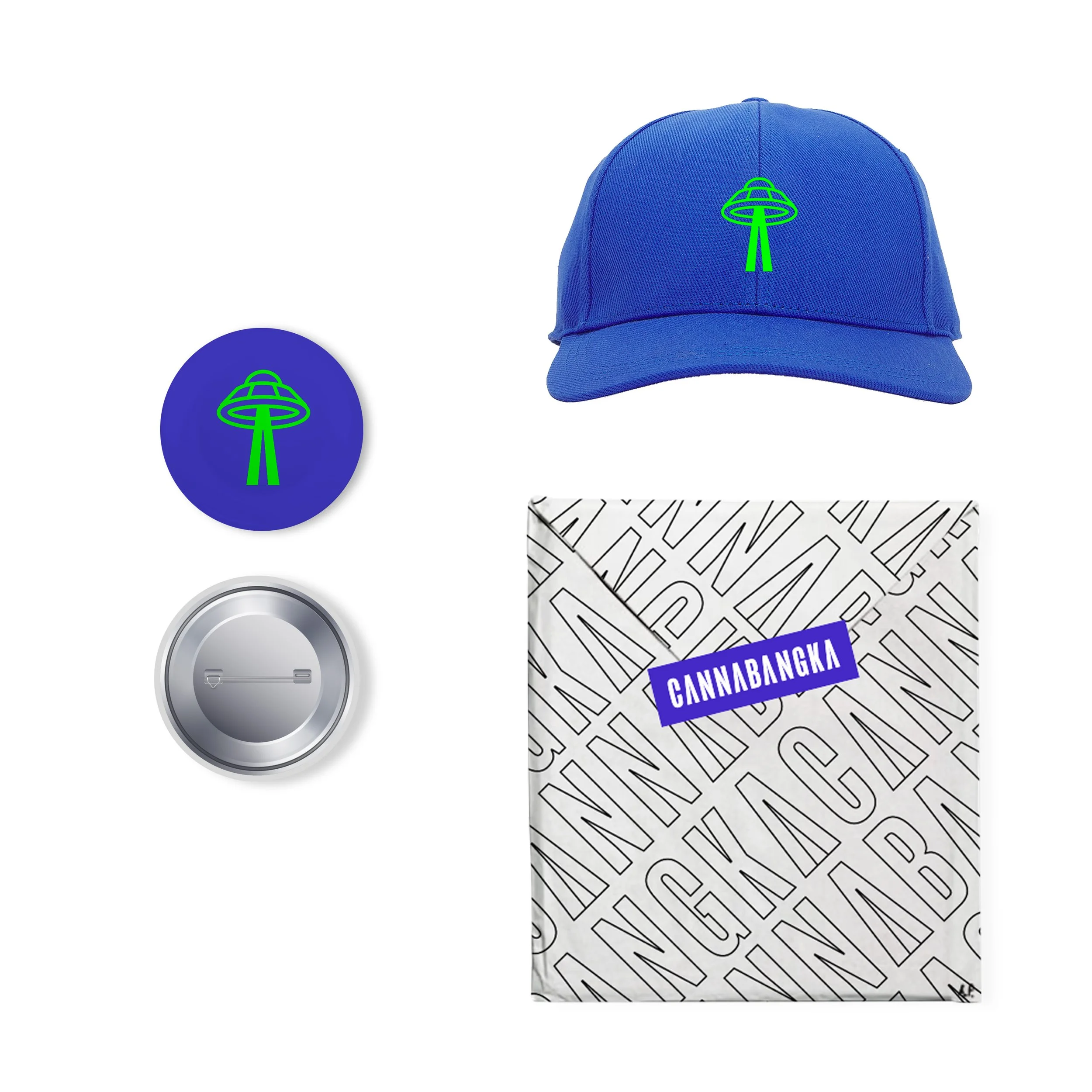 A blue baseball cap with a green UFO logo, a round pin with the same logo, a silver button, and a white sheet of paper with black text and a purple label reading 'CANNABANGKA'.