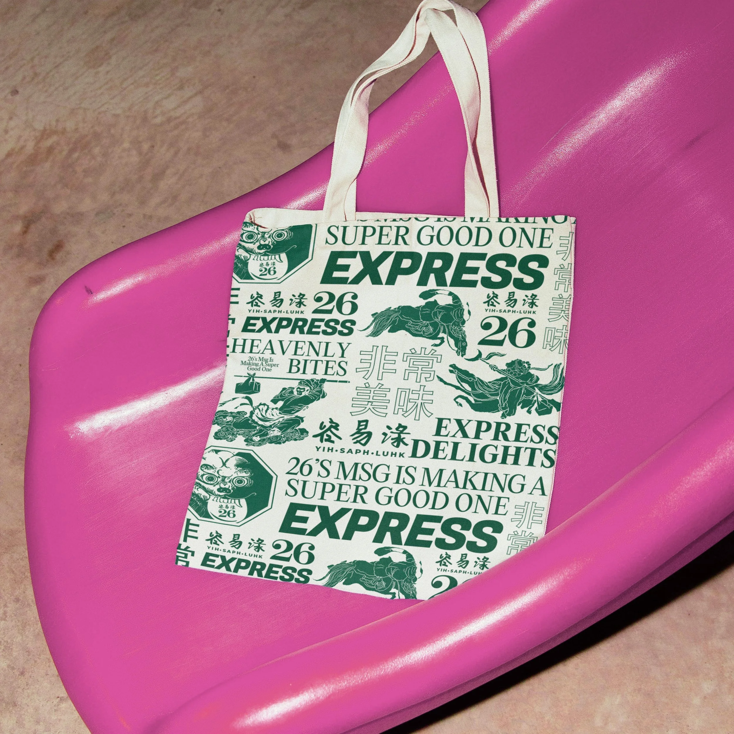 A white tote bag with green text and illustrations resting on a pink bench.