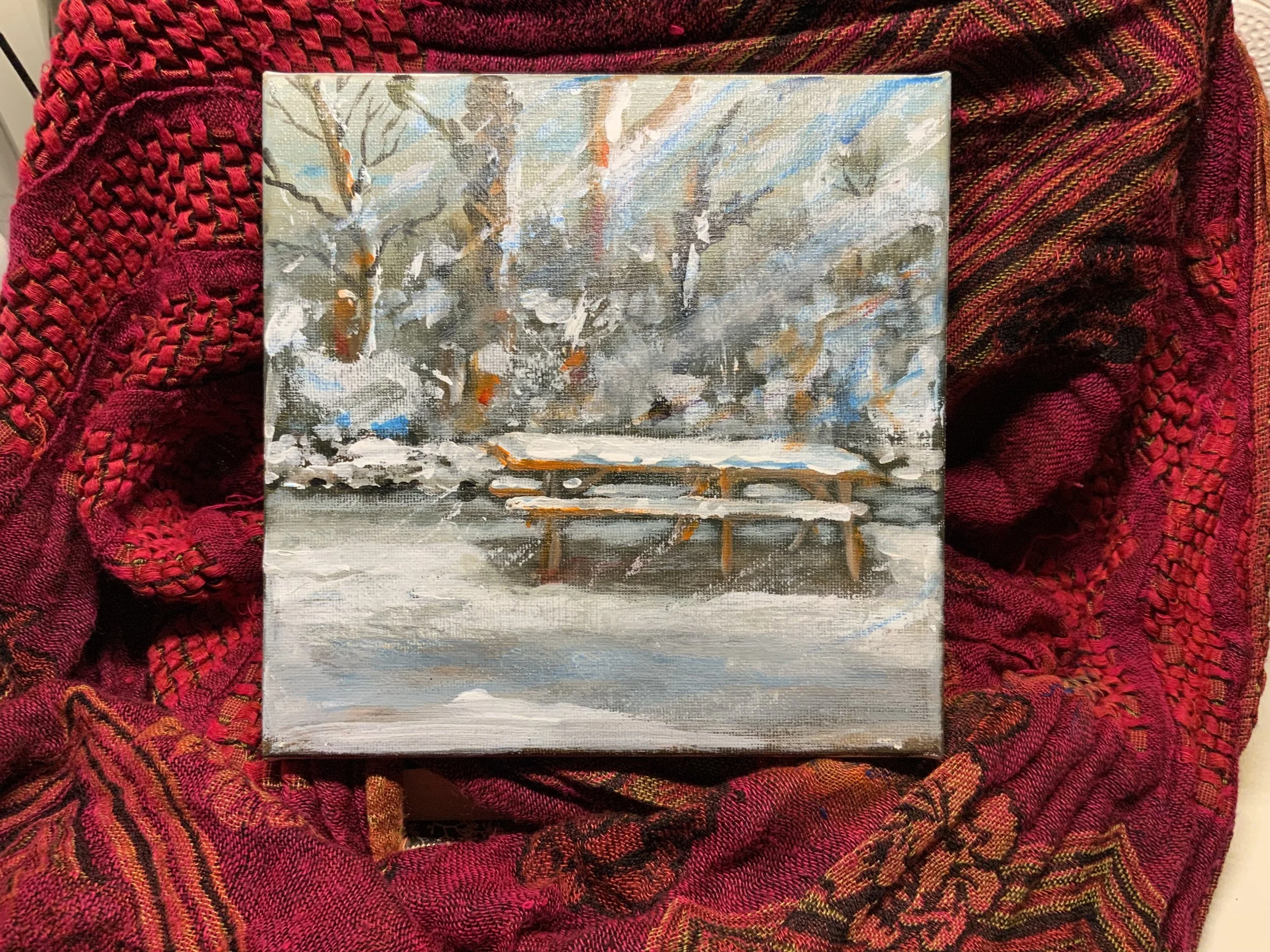 Picnic bench in snow