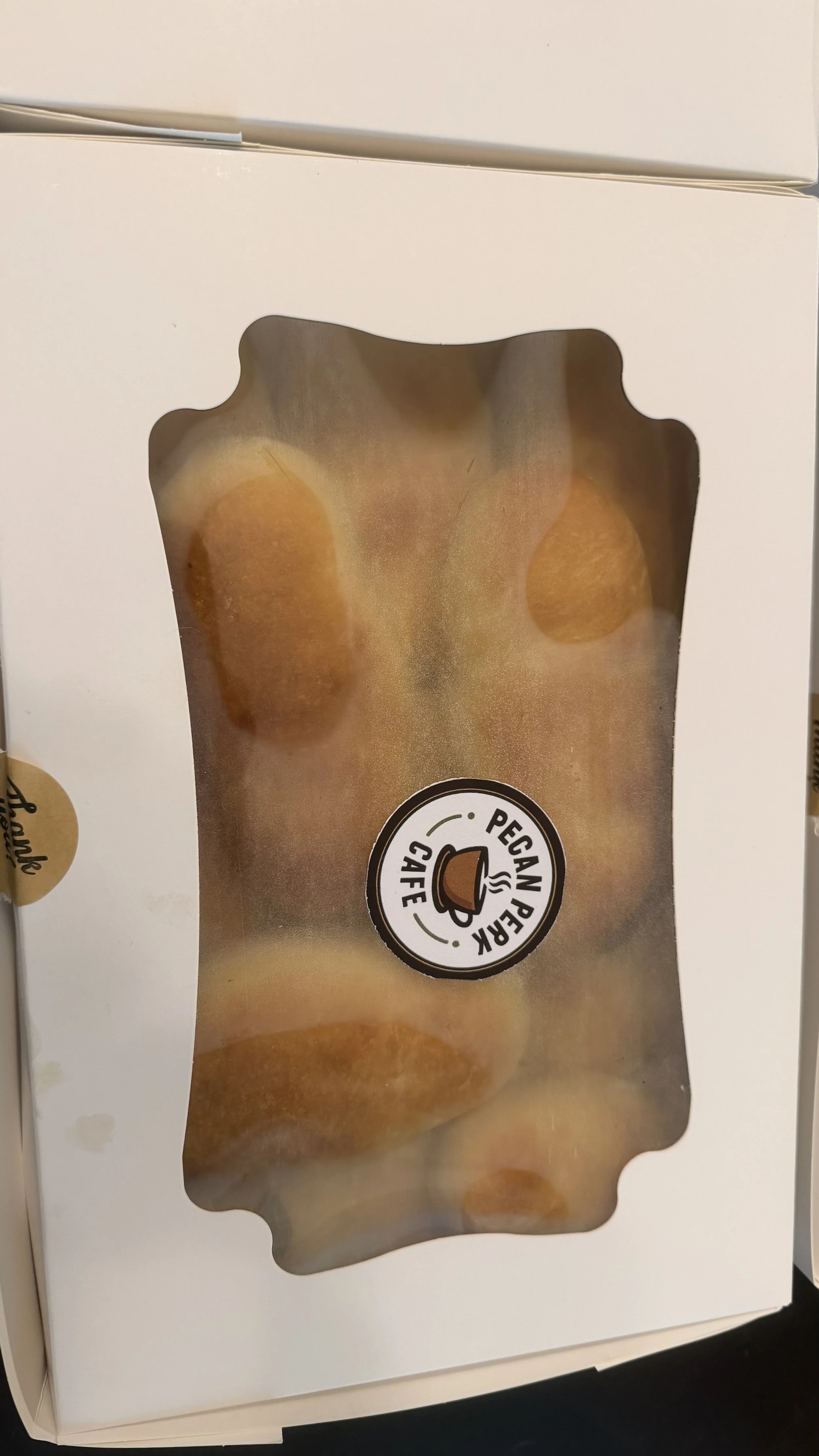 Box of peacan pecan cookies with a window showing the cookies inside.