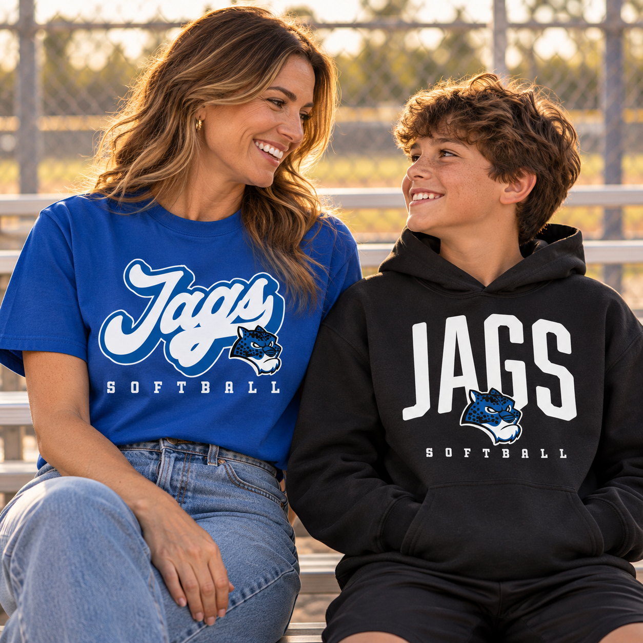 Woman and boy wearing coordinated Jags Softball fan apparel.