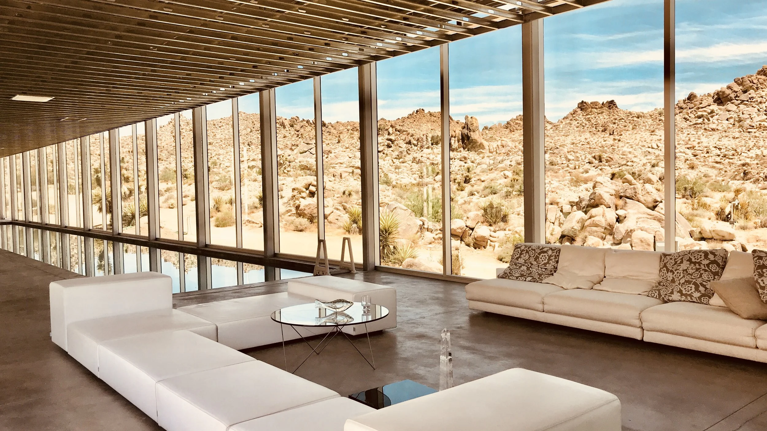 Futuristic and Famous mirrored glass home located in Joshua Tree with interior pool
