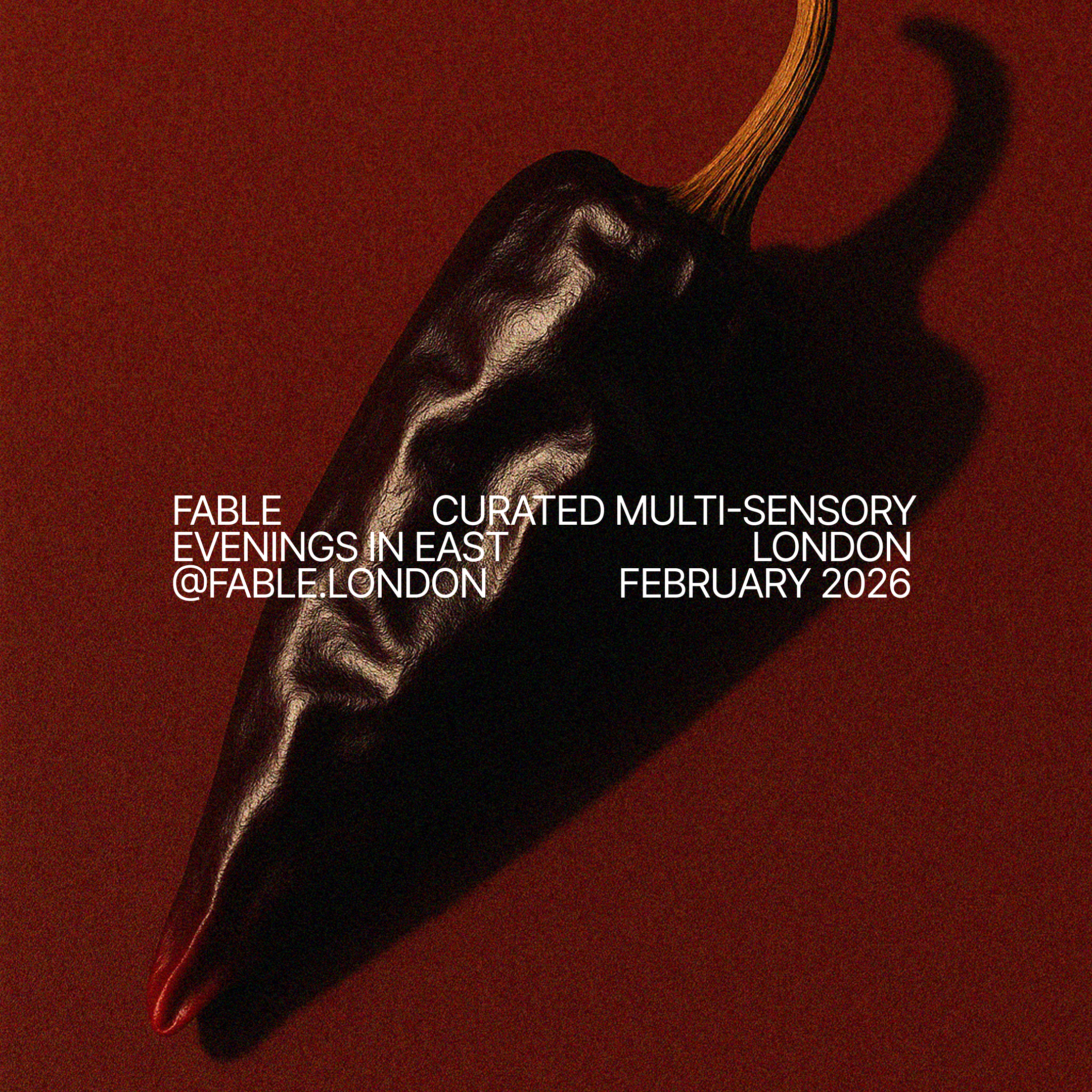 Black chili pepper with a red tip on a red background, overlaid with white text promoting a multi-sensory event in London in February 2026.