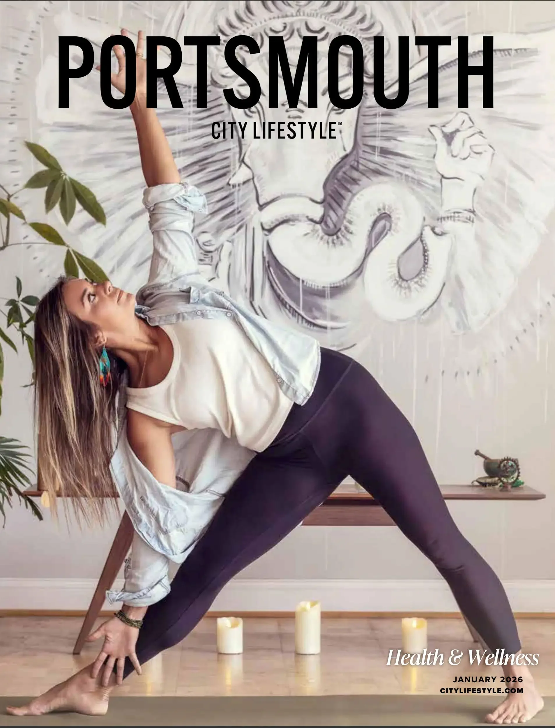 Woman practicing yoga indoors with a large mural of a woman's face and abstract background on the wall behind her. Decor includes a plant, candles, and a wooden bench. Text overlay mentions health and wellness, January 2026, and citylifestyle.com.