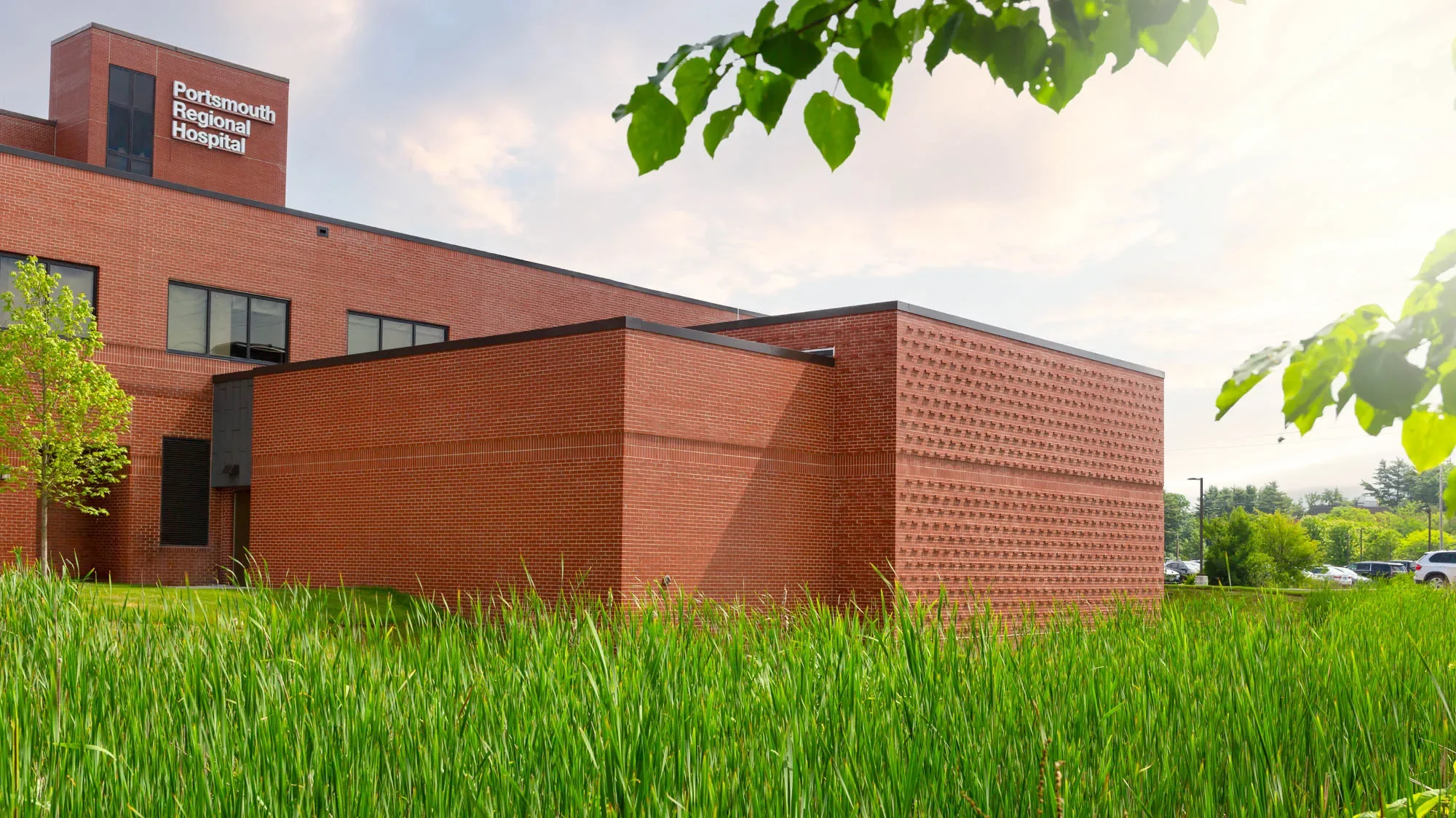 Exterior architecture of Portsmouth Regional Hospital medical facility providing commercial infrastructure scale.