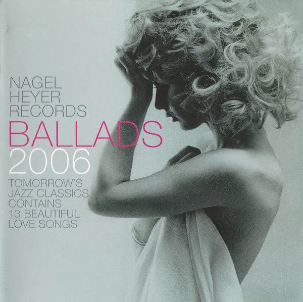 Cover of a music album titled 'Ballads 2006' by Nagel Heyer Records featuring a black and white photo of a woman with curly hair, covering her face with her hand, draped in a white cloth.