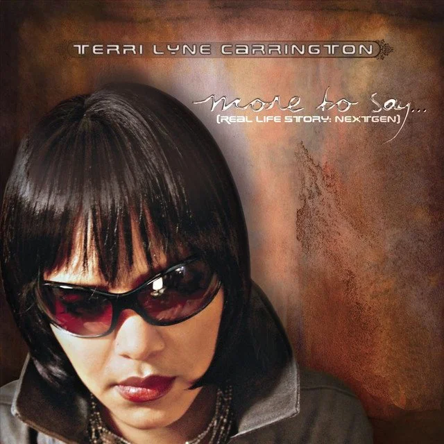Cover of Terri Lyne Carrington's album titled 'More to Say... (Real Life Story: Next Gen)', featuring a woman with short dark hair wearing sunglasses, against a textured brown background.